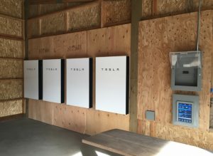 Tesla Powerwall solar battery installation with multiple units for home energy storage and backup